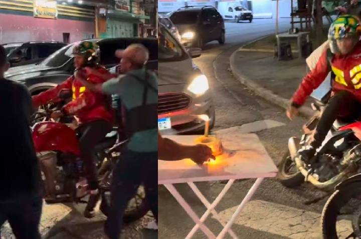 Motoboy ganha aniversário surpresa no farol, mas bolo explosivo gera revolta com chute na mesa